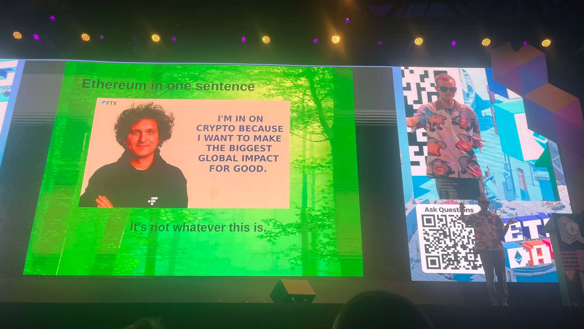Vitalik Buterin onstage with slideshow of Sam Bankman-Fried behind him