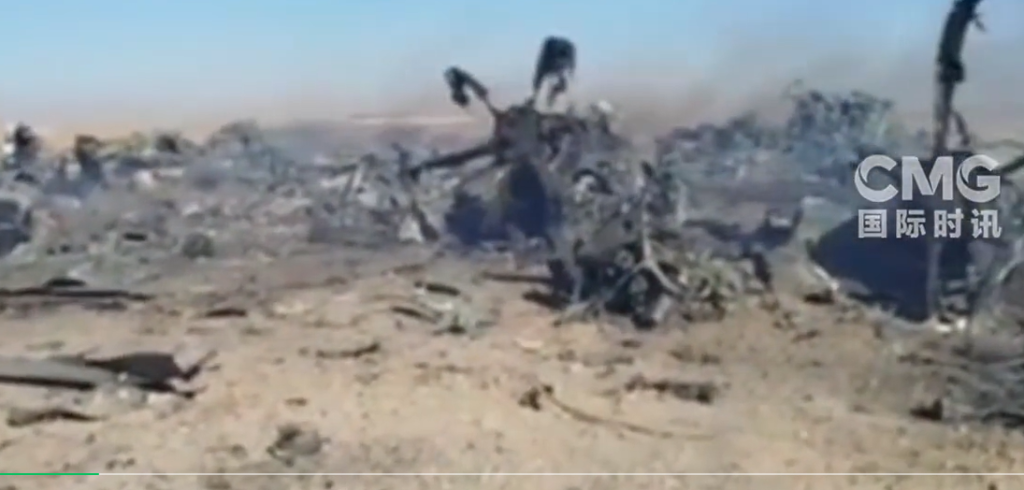 Iranian media released images of the "downed" US military aircraft: wreckage scattered everywhere, with lingering smoke.